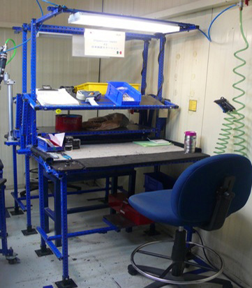 Assembly Workstation complete with table, overhead light - made with Flex Craft products.