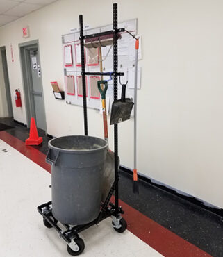 Brooms, dustbin, and large grey trash can on a Mobile Cleaning Station made Flex Craft steel tubing.