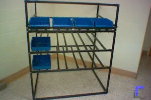 A static Flex Craft Flow Rack Conveyor with blue block bins.