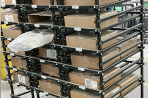 A static Flex Craft Flow Rack Conveyor with lots of product boxes.