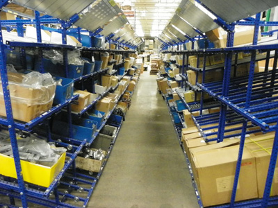 An organized isle of Flex Craft shelving units storing products.