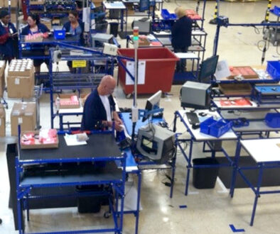 Employees in work-cells at workstations made from Flex Craft tubing.